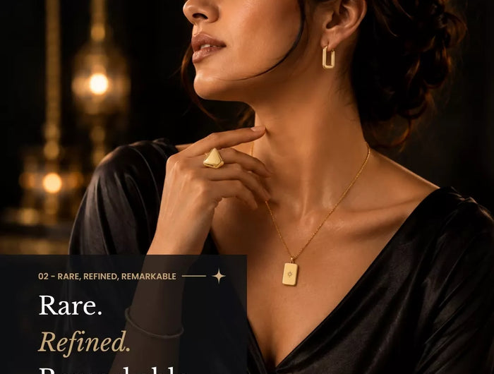 Elegant woman wearing gold jewellery and a black dress, showcasing Mitrava’s refined signature jewellery collection.