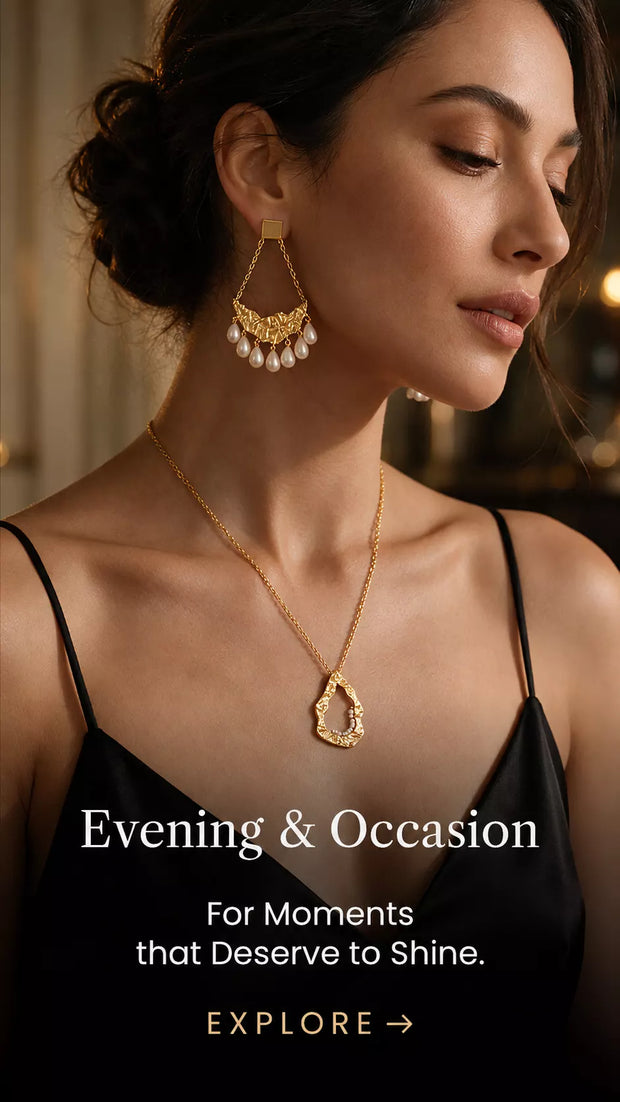 Woman wearing gold statement earrings and a pendant necklace, showcasing Mitrava jewellery for evening occasions.